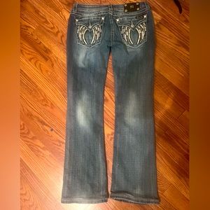 Miss Me jeans. Feathers on back pockets
